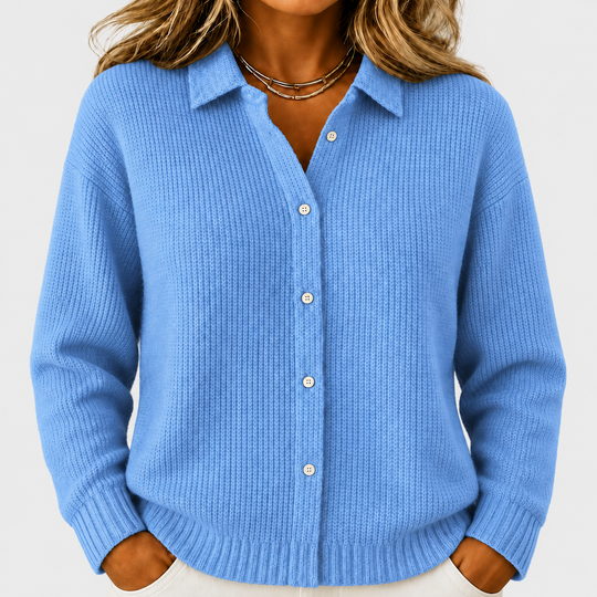 Caitlin blue knitted jacket on a neutral grey background