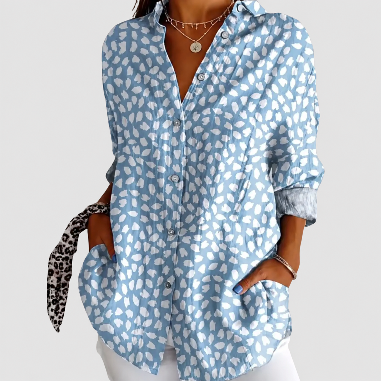 Riley patterned blouse on a neutral grey background