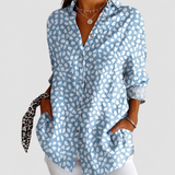 Riley patterned blouse on a neutral grey background
