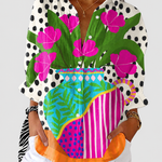 Amara floral vase print blouse on a neutral grey background