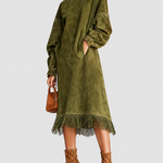 Juniper green fringe dress on a neutral grey background