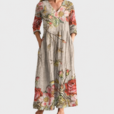 Bella floral maxi dress on a neutral grey background