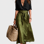 Green tie waist maxi skirt on a neutral grey background