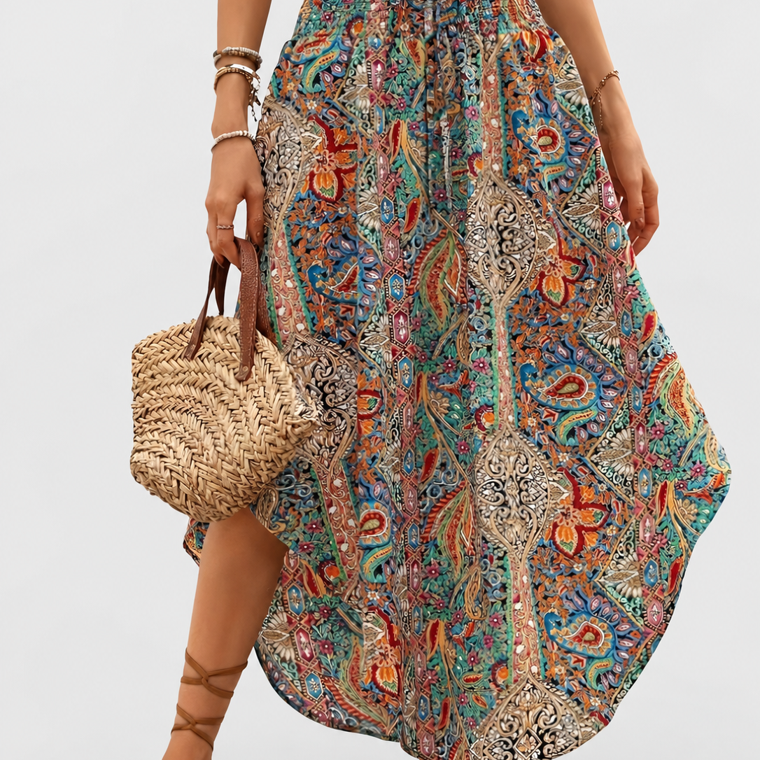 Boho High Waist Maxi Skirt with Paisley Print and Asymmetric Hem on a neutral light grey background