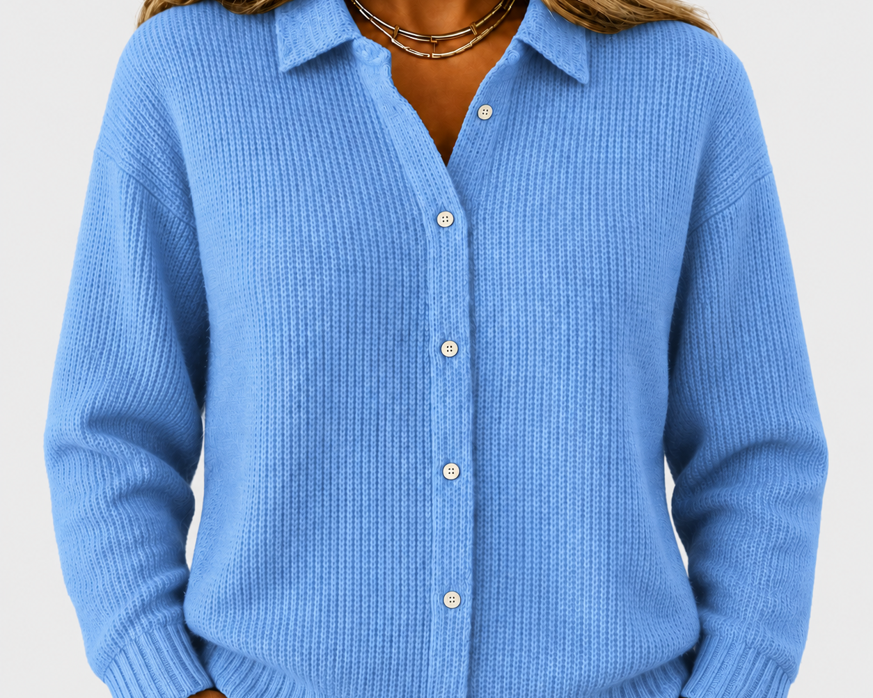 Caitlin blue knitted jacket on a neutral grey background