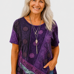 Calla purple patchwork top on a neutral grey background