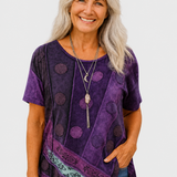 Calla purple patchwork top on a neutral grey background