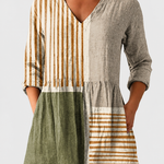 Camille | Neutral Stripe V-Neck Blouse on a neutral light grey background