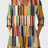 Chloe | Earthy Floral V-Neck Blouse on a grey background