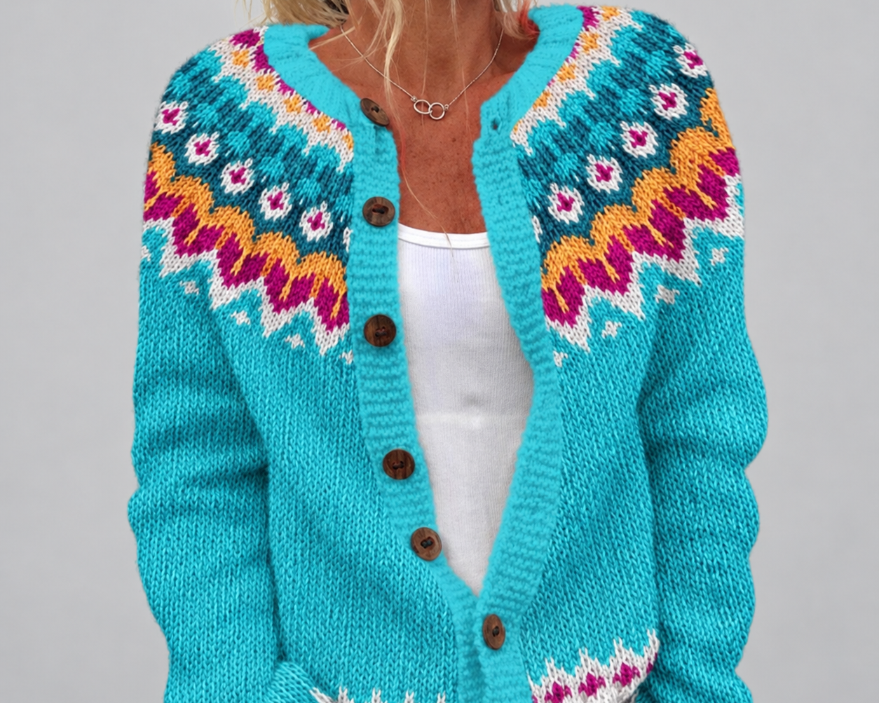 Olivia | Turquoise Fair Isle Knitted Cardigan on a grey background