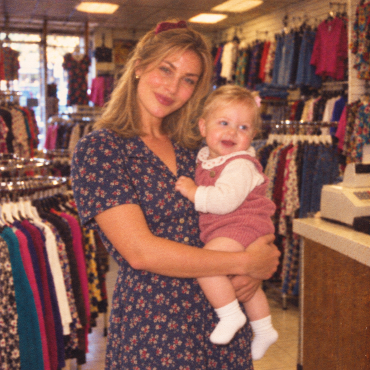 Dua York owner holding her daughter in the clothing shop.